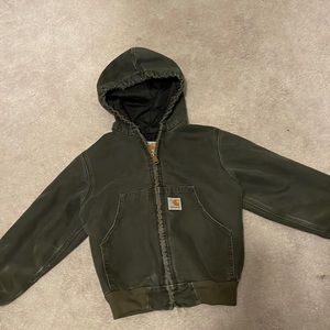 Dark gray hooded Carhartt zip up jacket.